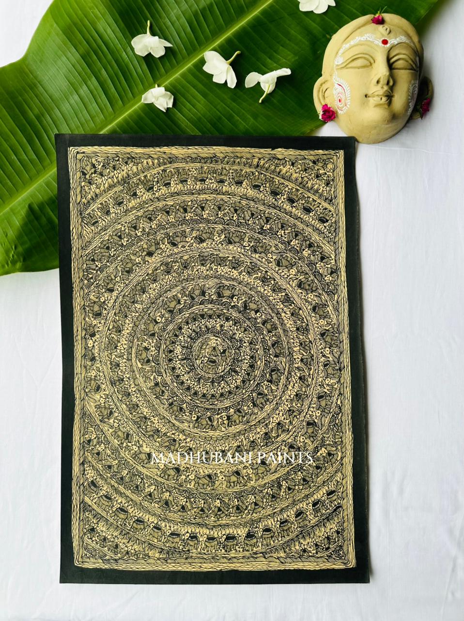 Madhubani mandala painting in black ink on natural cream cloth, concentric rings of tiny repeating figures radiating from a central flower