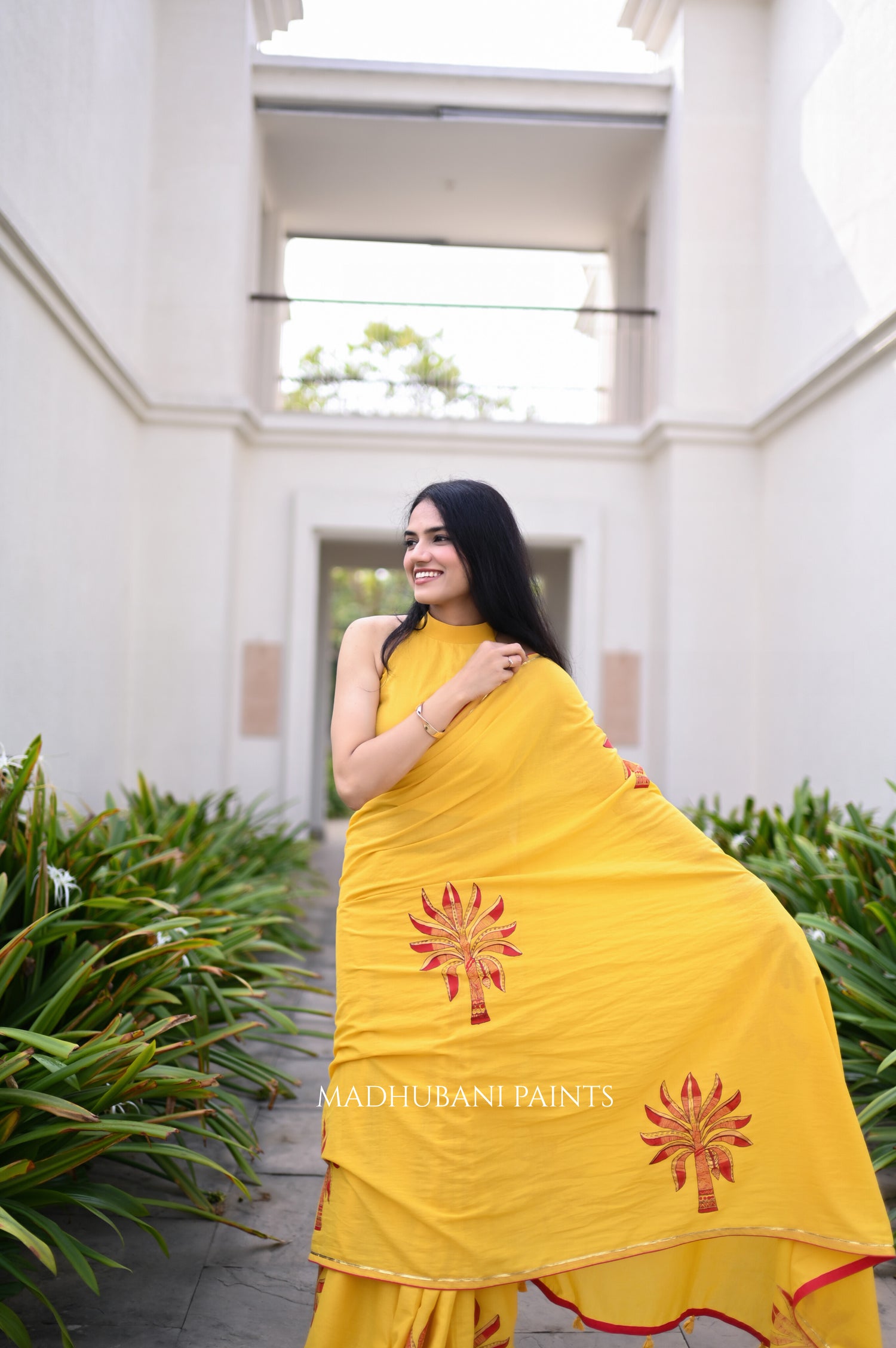 saree draped, showing the hand-painted aanchal