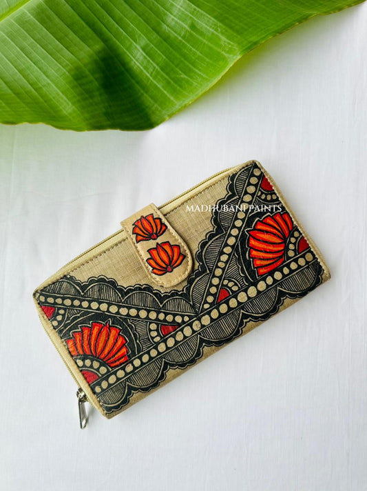 Hand-painted Madhubani clutch in turquoise with a bold diagonal triangle pattern and two lotus, a matching lotus motif on the tab closure