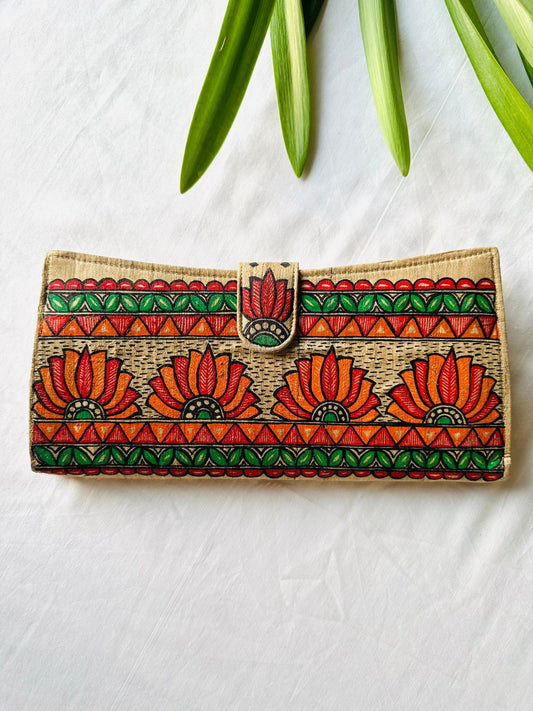 Hand-painted Madhubani clutch in beige with four orange-red lotus flowers, framed by a green leaf border and orange triangle stripes