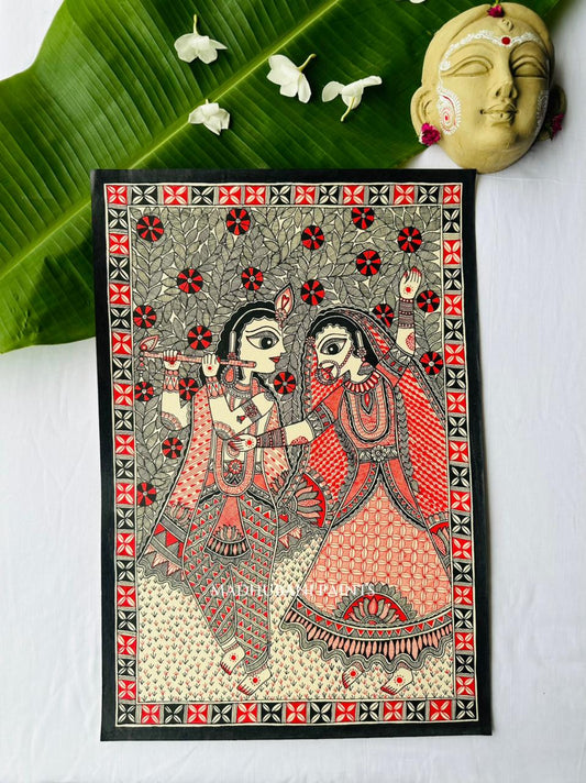 Madhubani painting of Radha and Krishna walking together beneath flowering trees over a grassy ground dotted with small red flowers