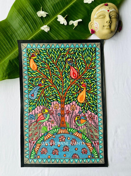 Colorful Madhubani tree of life painting with four birds perched among green leaves, a pink ground, and a semicircular blue lotus pond at the base