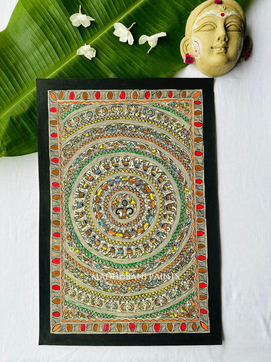Colorful Madhubani mandala painting with concentric rings of elephants, fish, and birds in orange, green, blue, and yellow, bordered with red ovals