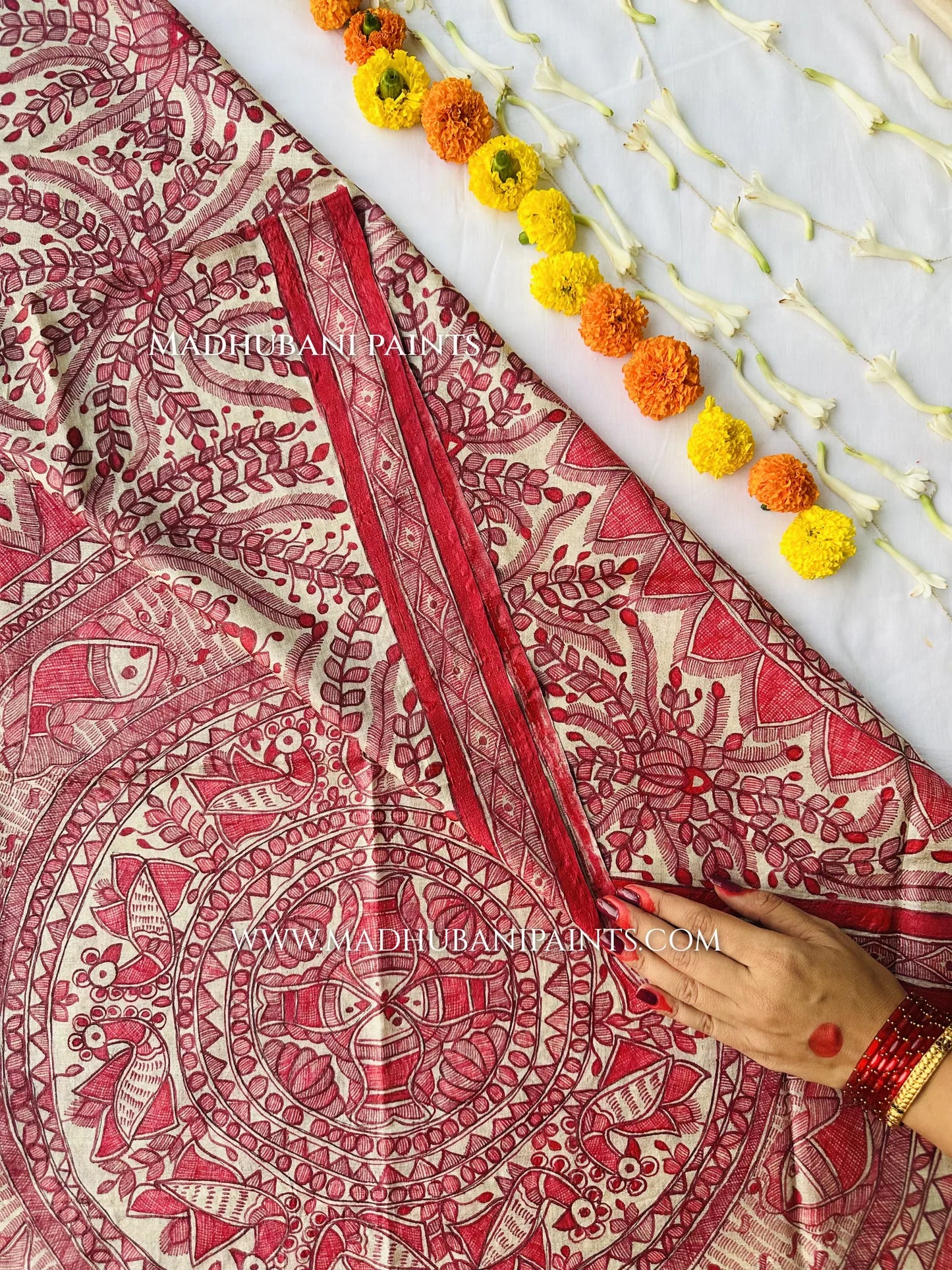 Three-piece hand-painted Madhubani suit set in cream and red: a kurta fabric with a painted neck yoke and lotus motifs, a bottom fabric with a painted border, and a matching dupatta.