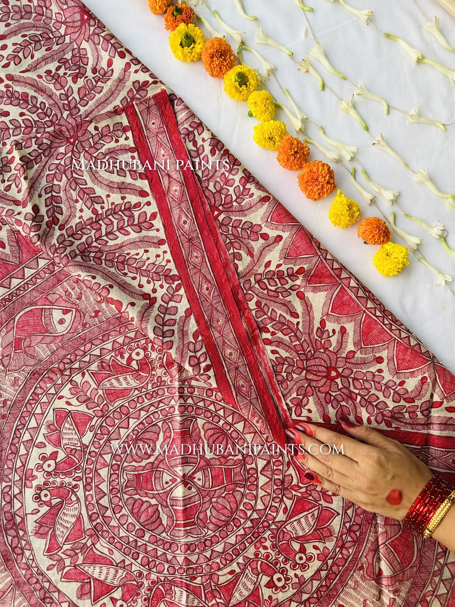 Three-piece hand-painted Madhubani suit set in cream and red: a kurta fabric with a painted neck yoke and lotus motifs, a bottom fabric with a painted border, and a matching dupatta.