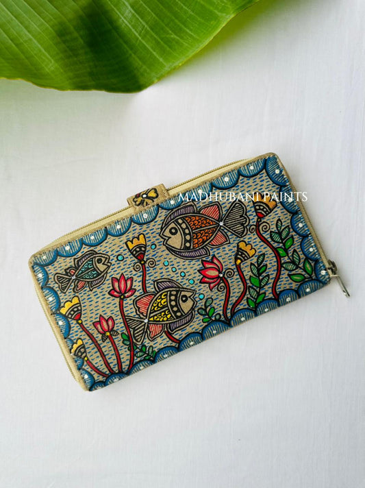 Hand-painted Madhubani clutch in turquoise with two fish facing a central lotus flower, painted water bubbles