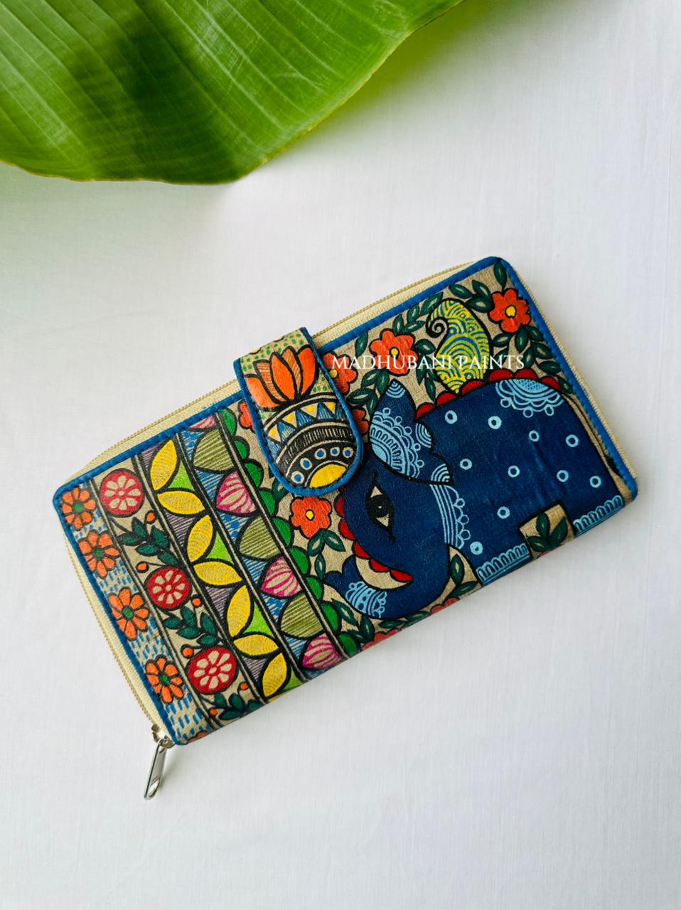 navy elephant head with floral border and colorful stripes

