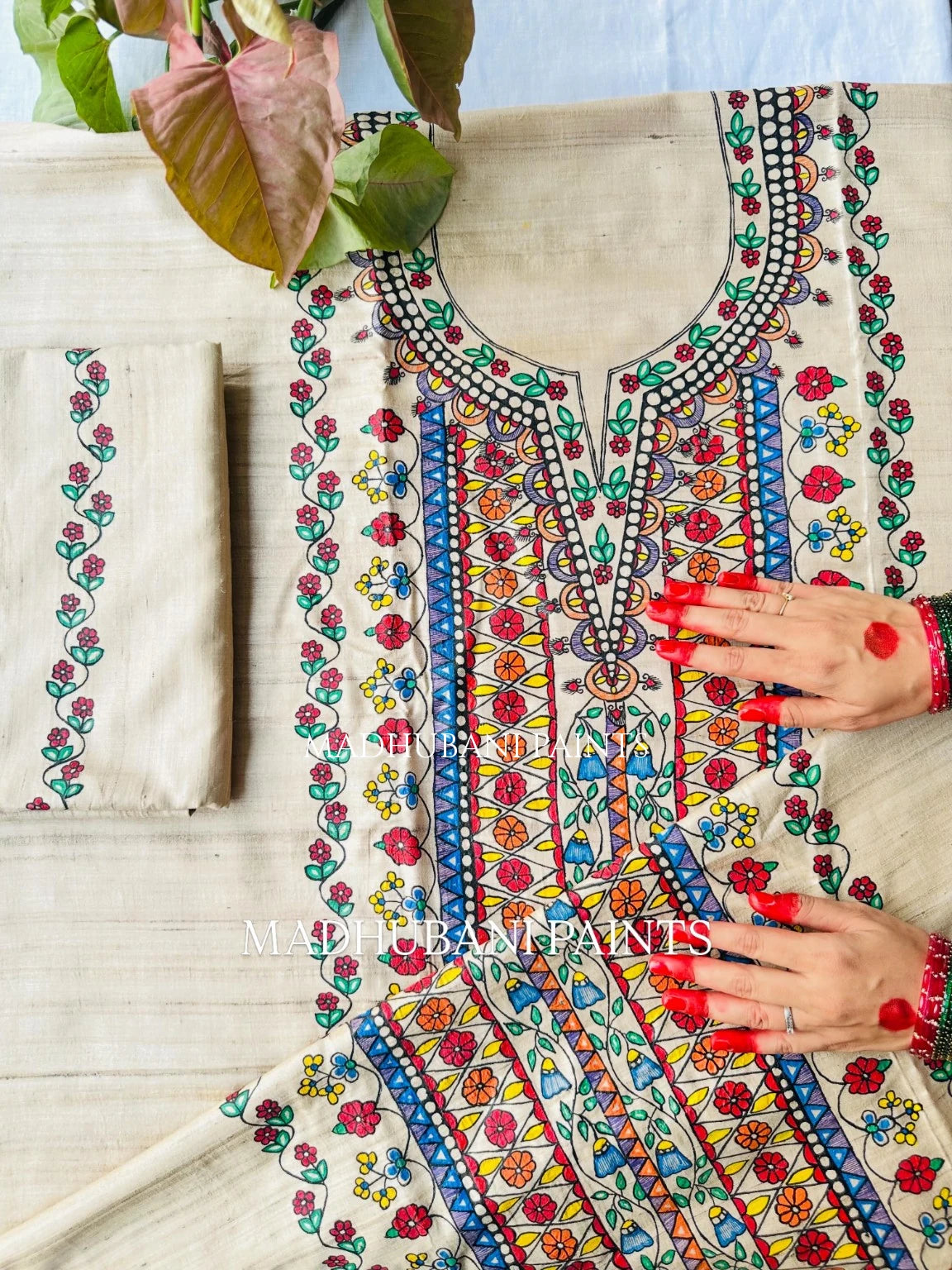 A beige cotton fabric kurta with vibrant multicolor madhubani painting floral and nature artwork