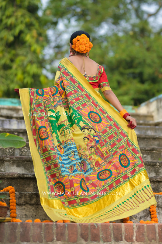 Woman in traditional madhubani attire with a chhath puja sare outdoors