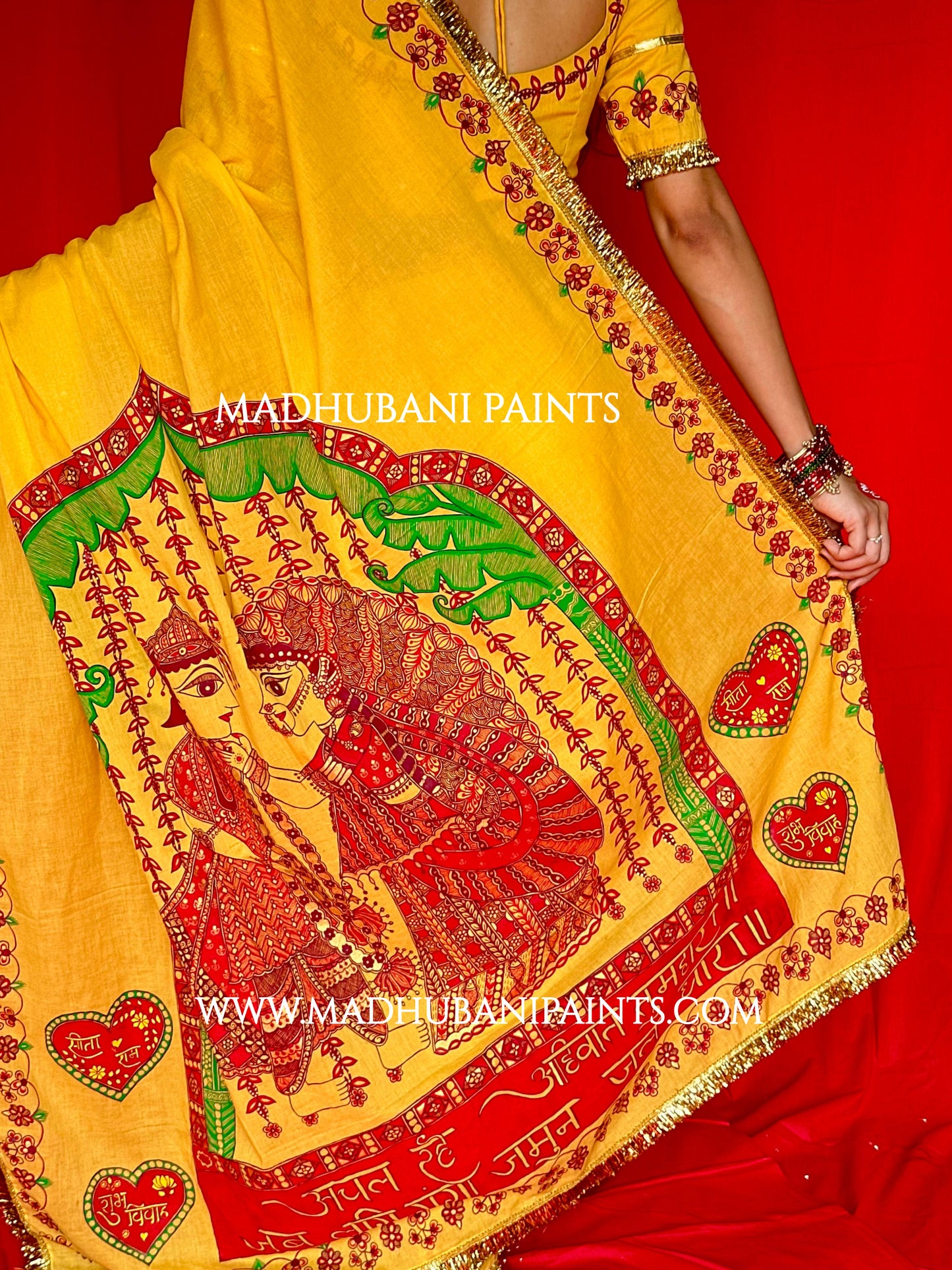Yellow saree with Ram Sita Madhubani painting on a red background