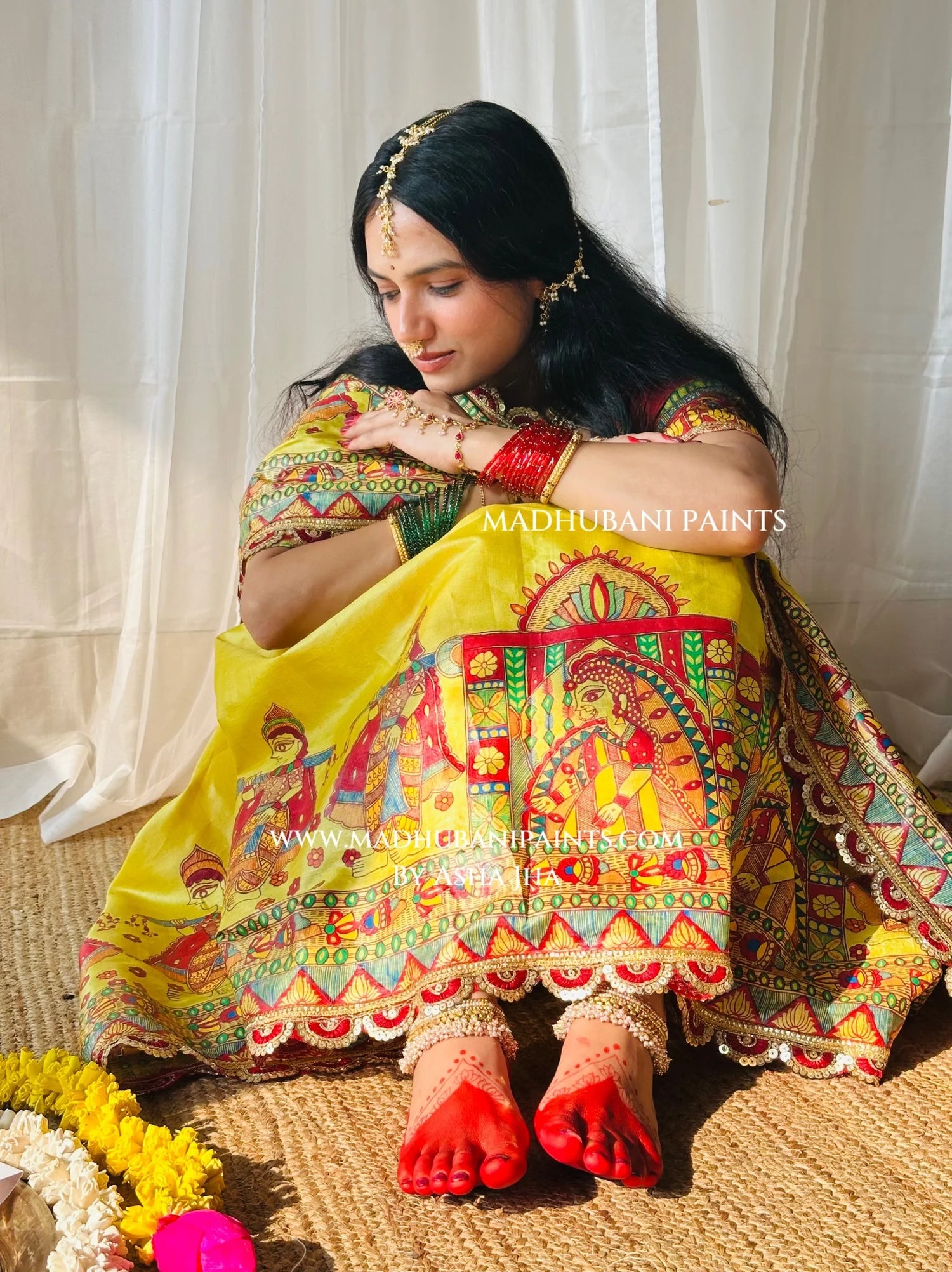 Devi Ki Sawari saree styled for Durga Puja with bright yellow hand-painted doli and bride motifs and traditional red alta.