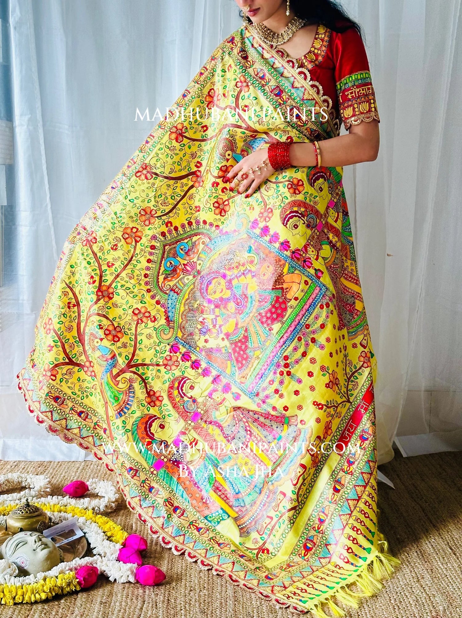 Wide view of Devi Ki Sawari Madhubani saree pallu with hand-painted Goddess Durga in a doli, floral branches and lotus borders.