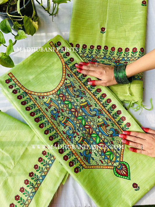 Green handloom cotton kurta fabric with hand-painted Madhubani fish and auspicious horse motifs in traditional Mithila art.