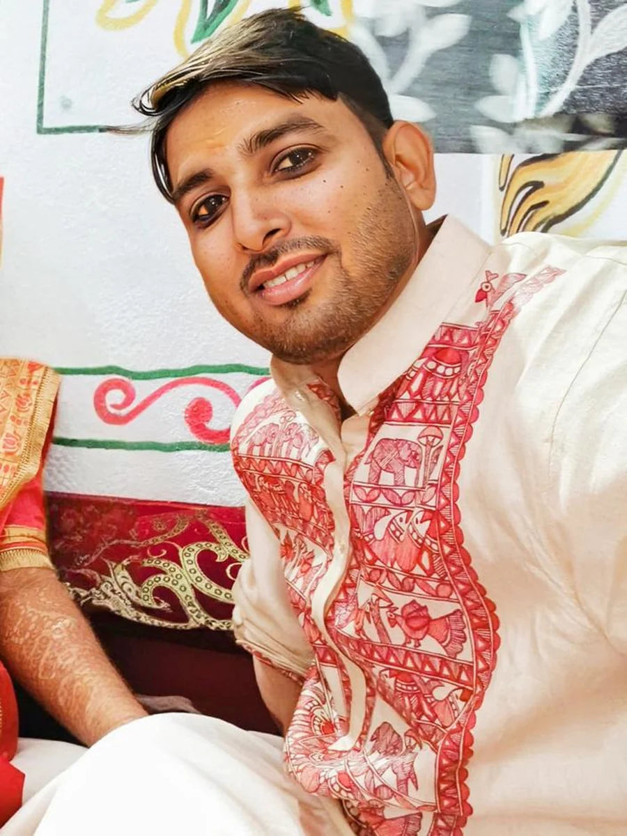Traditional beige Madhubani wedding kurta for men, featuring hand-painted red and maroon artwork inspired by Mithila's cultural heritage