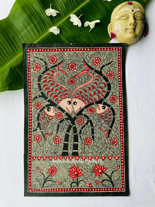 A rectangular hand-painted madhubani folk art canvas featuring two madhubani fish with red and black details