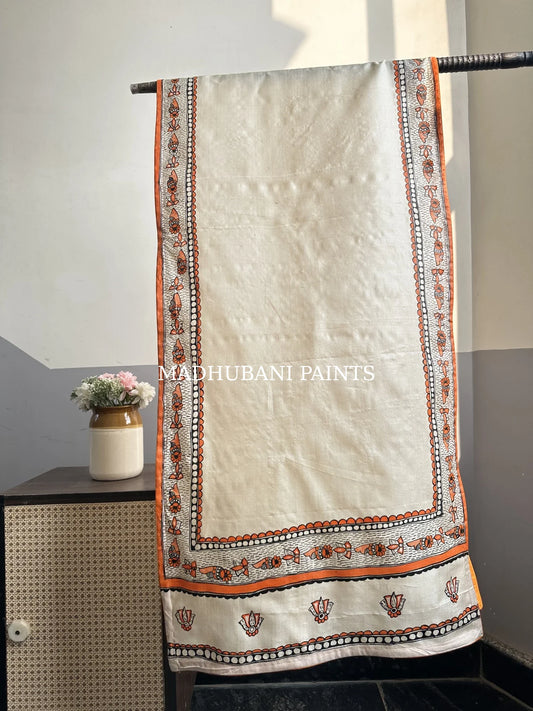 Beige silk stole featuring black and orange coloured hand-painted Lotus and saankh motifs and intricate Madhubani-style borders, handcrafted in traditional Mithila painting art.