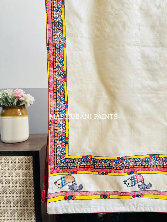 A beige silk stole with colorful hand-painted fish and madhubani borders in madhubani painting art