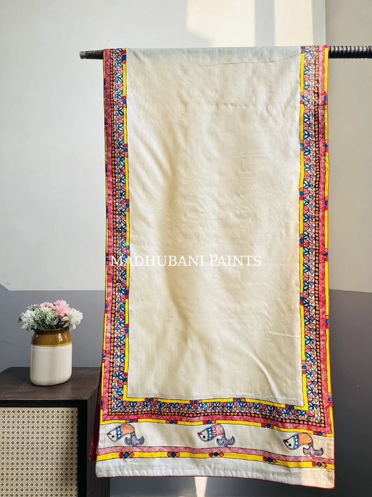 A beige silk stole with colorful hand-painted fish and madhubani borders in madhubani painting art