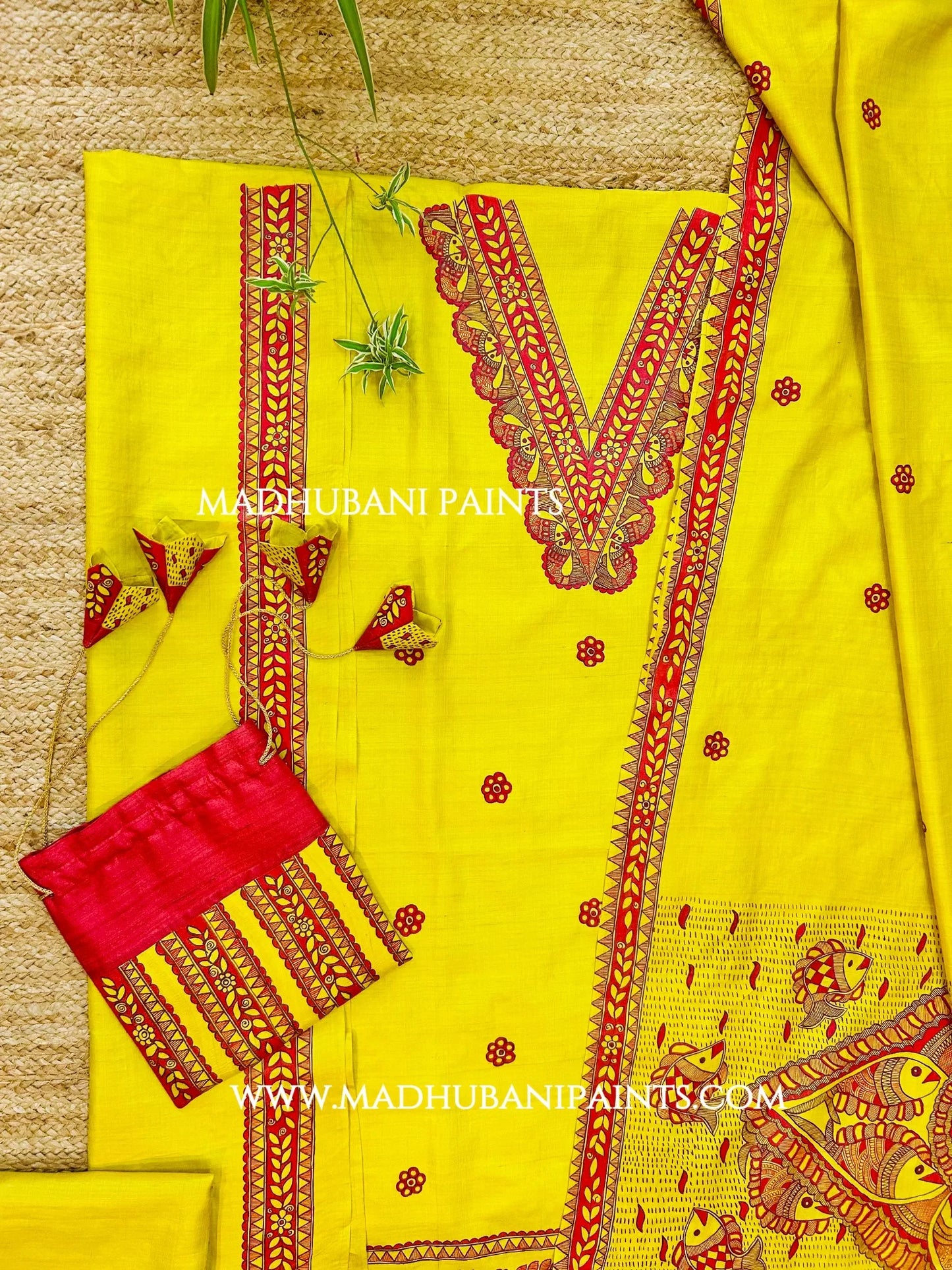 Yellow hand-painted Madhubani kurta with traditional fish artwork, perfect for weddings and festive celebrations.