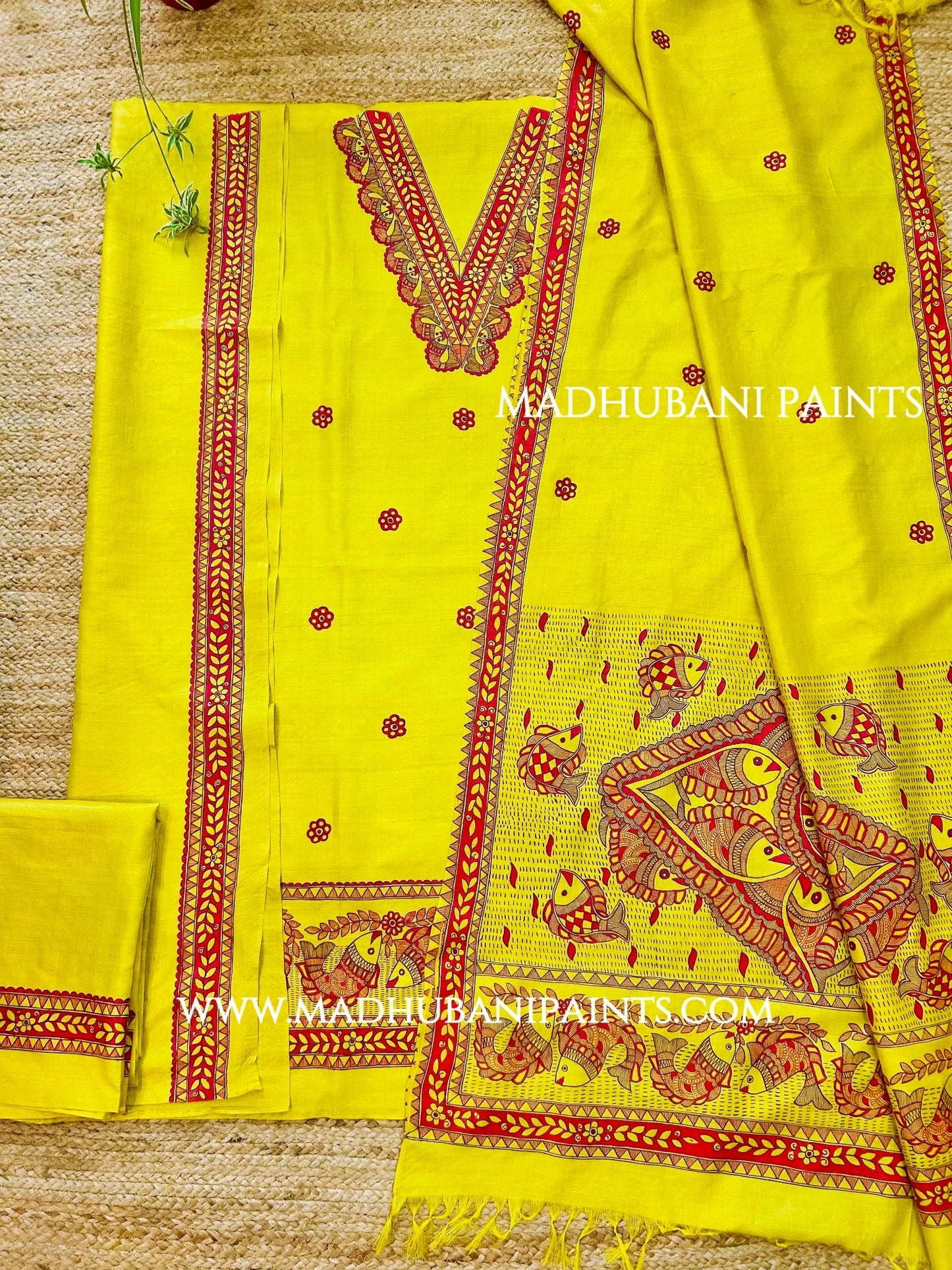 Bright yellow Madhubani painting kurta set featuring intricate red fish motifs and traditional Mithila artwork for weddings.
