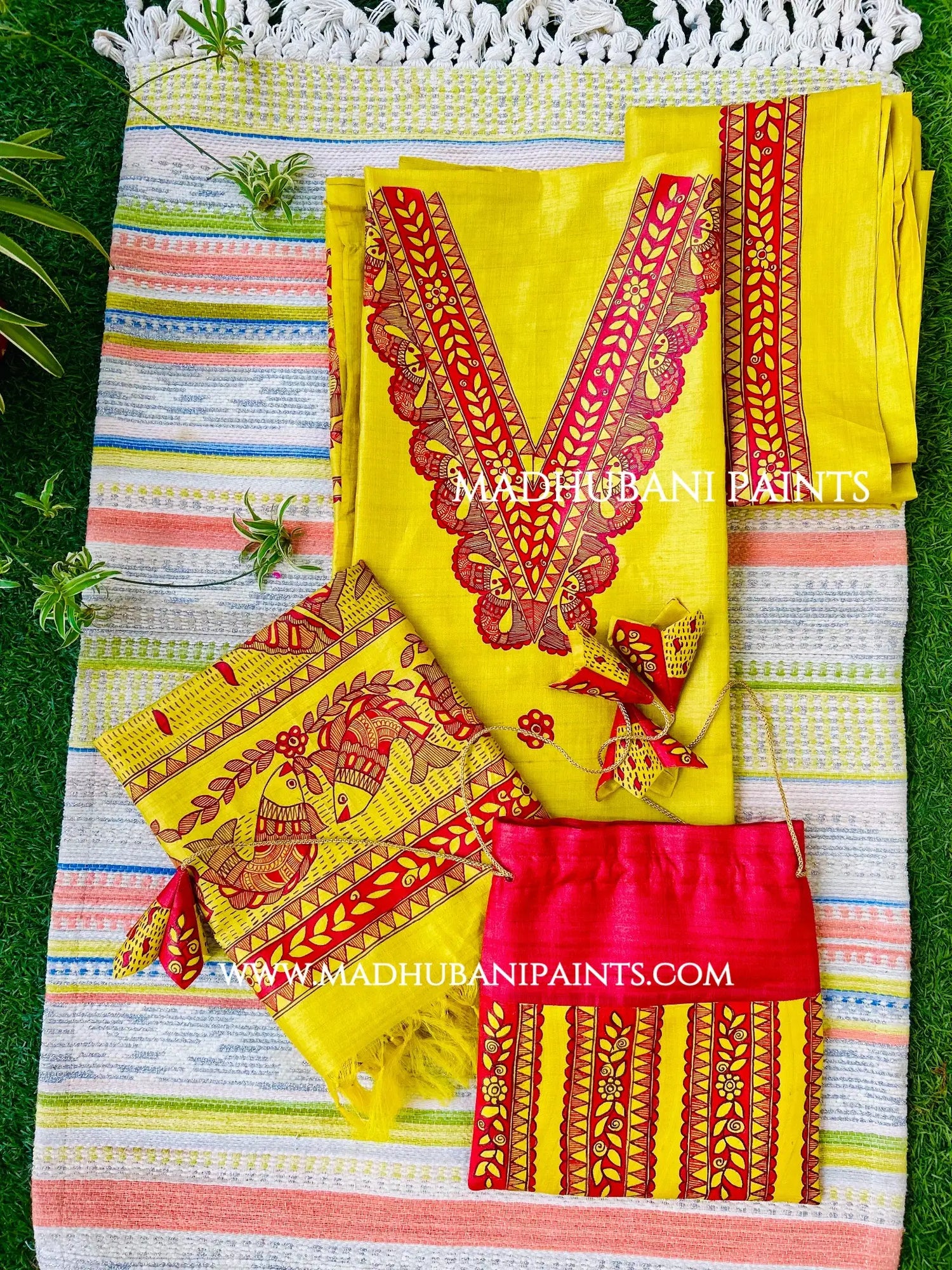 Yellow hand-painted Madhubani kurta with matching dupatta, featuring fish artwork and traditional borders for festive wear.